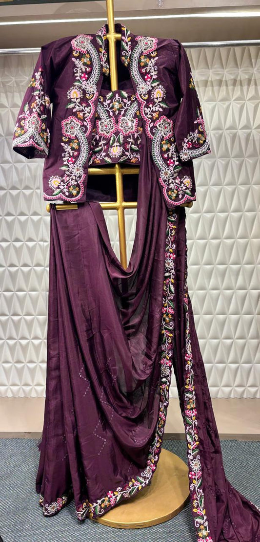 Elegantly draped in a Russian crepe saree with intricate Resham