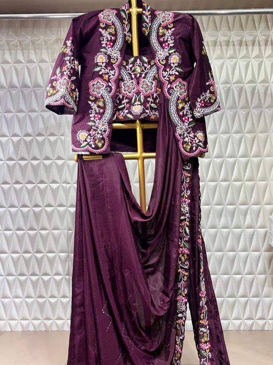 Elegantly draped in a Russian crepe saree with intricate Resham