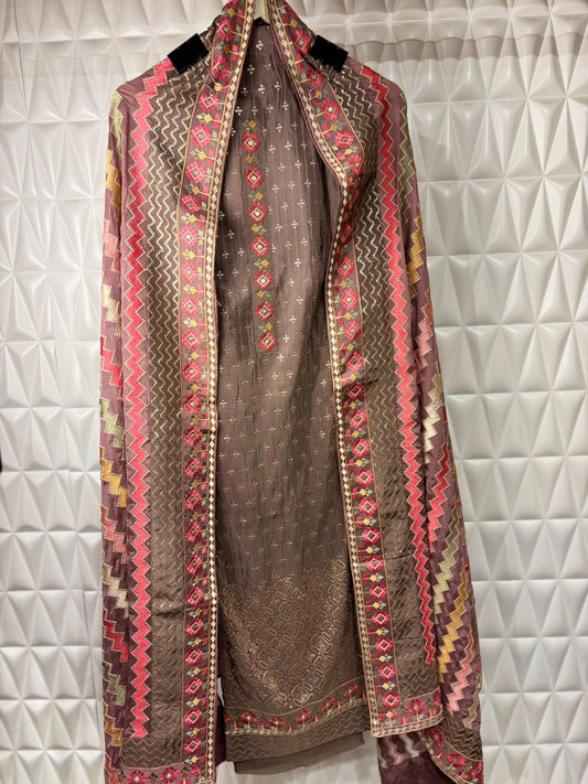 Silk suit adorned with intricate thread weaving