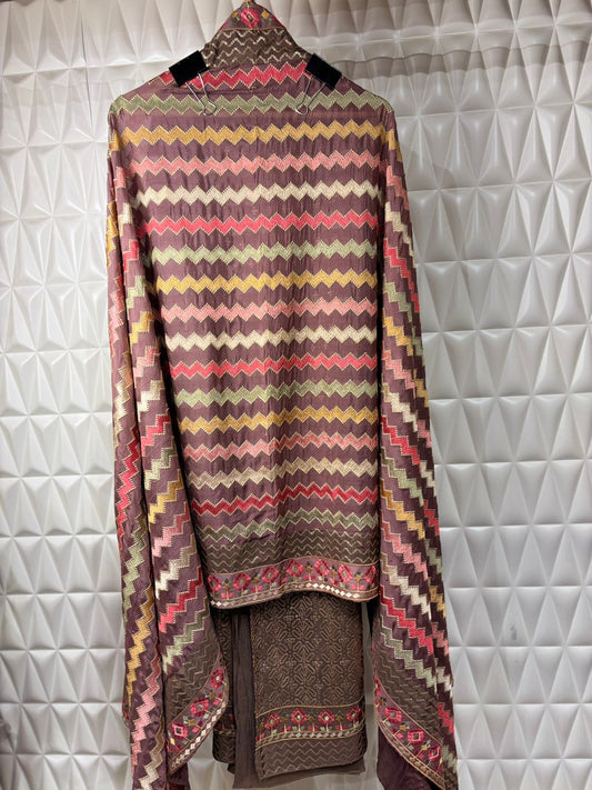 Silk suit adorned with intricate thread weaving