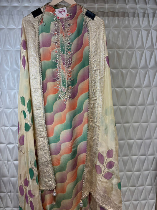 Timeless elegance in every detail. Lovely suit adorned with intricate hand