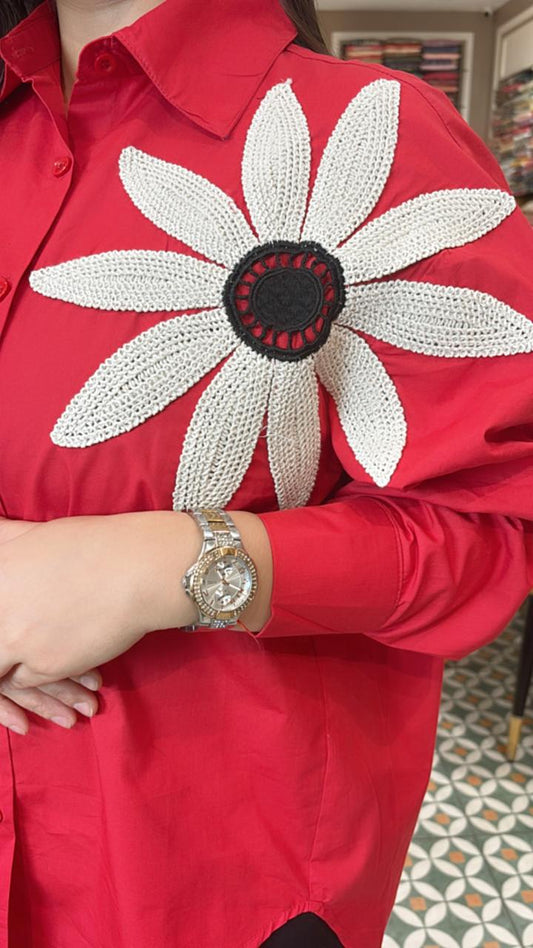 Classy essential with a bold floral patch on the shoulder