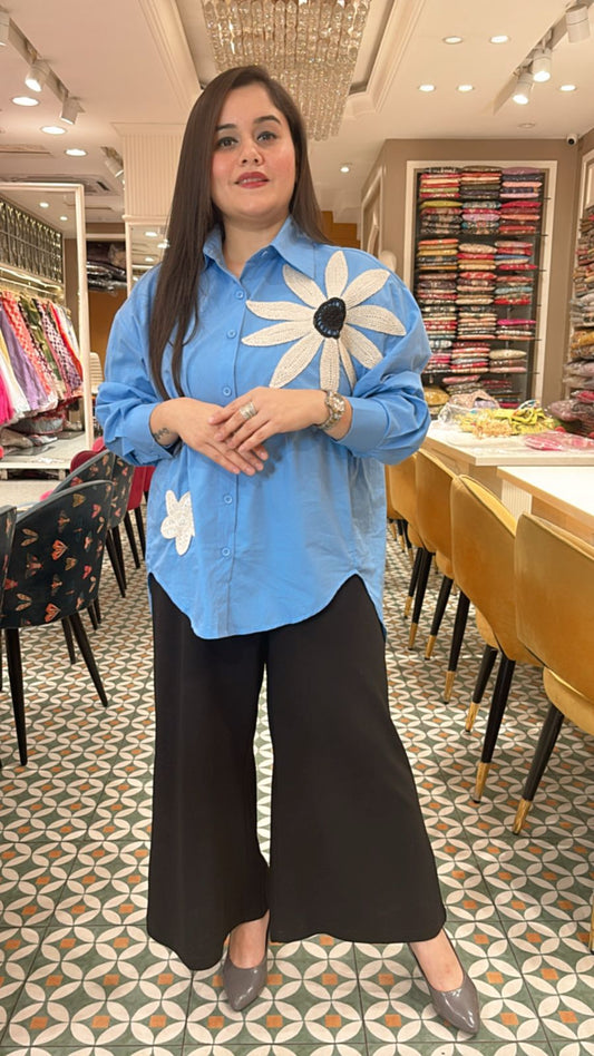 Classy essential with a bold floral patch on the shoulder