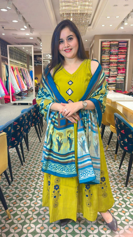 Timeless grace with our parrot green Cotton muslin Anarkali Ensemble.