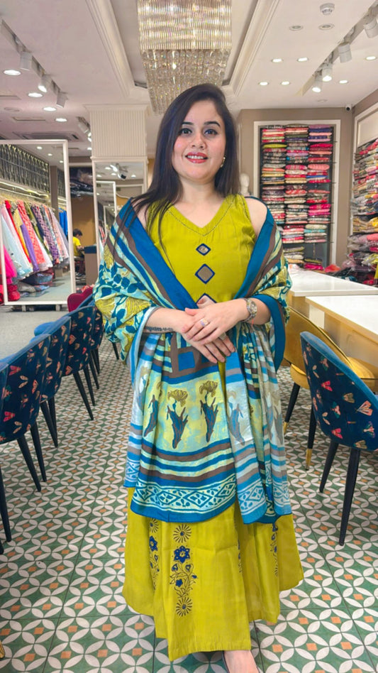 Timeless grace with our parrot green Cotton muslin Anarkali Ensemble.