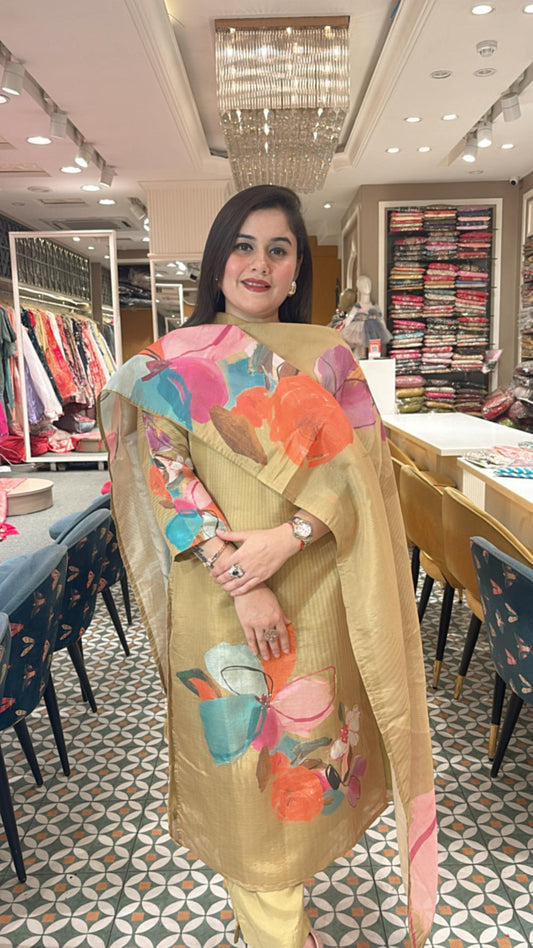 Crafted in lightweight tissue fabric, this stitched suit set features vibrant prints