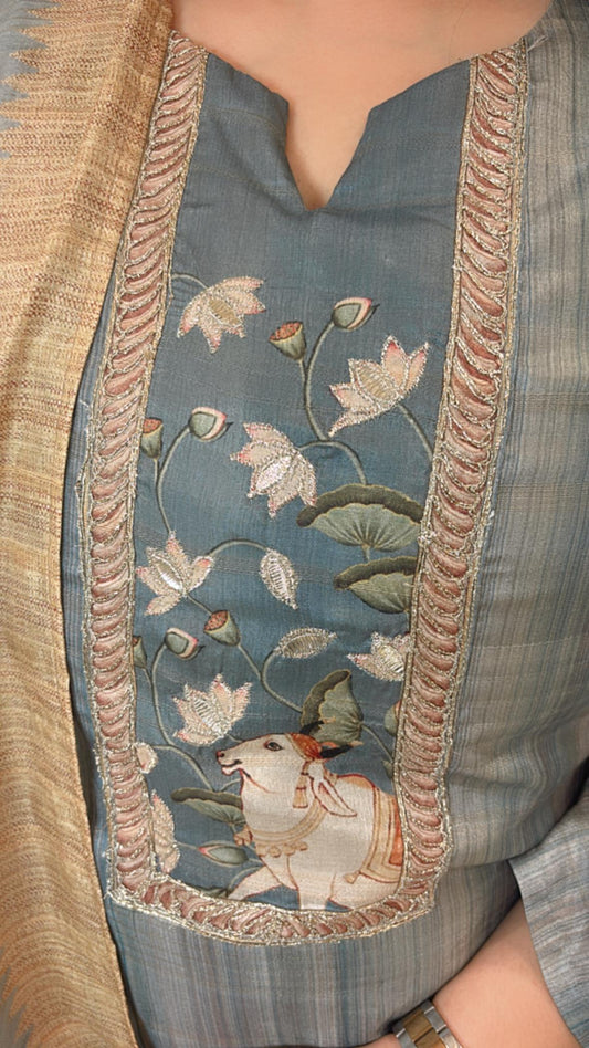 Stitched suit set features vibrant Pichwai prints perfect for summer