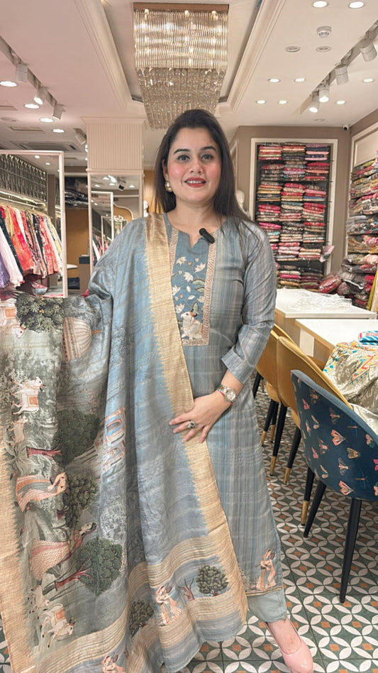 Stitched suit set features vibrant Pichwai prints perfect for summer