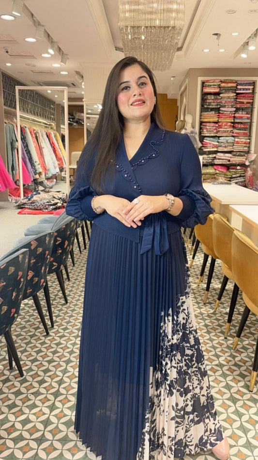 Crafted from breathable cotton Lycra, this pleated dress combines