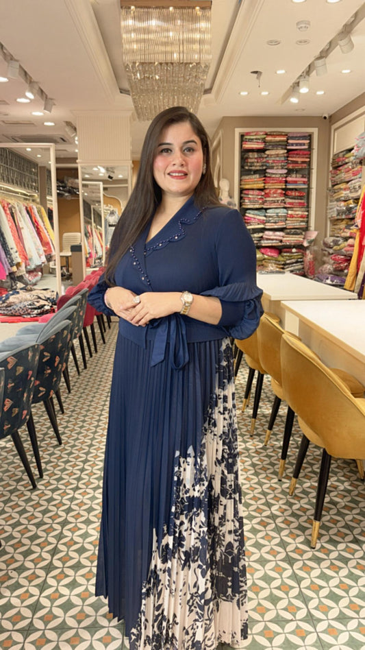 Crafted from breathable cotton Lycra, this pleated dress combines