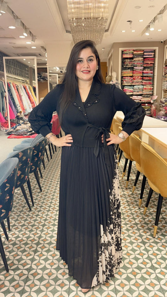 Crafted from breathable cotton Lycra, this pleated dress combines