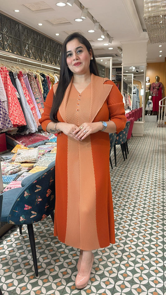 Crafted from breathable cotton Lycra, this pleated dress combines effortless