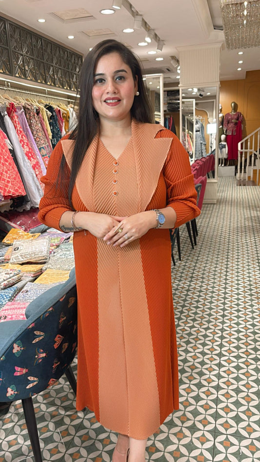 Crafted from breathable cotton Lycra, this pleated dress combines effortless