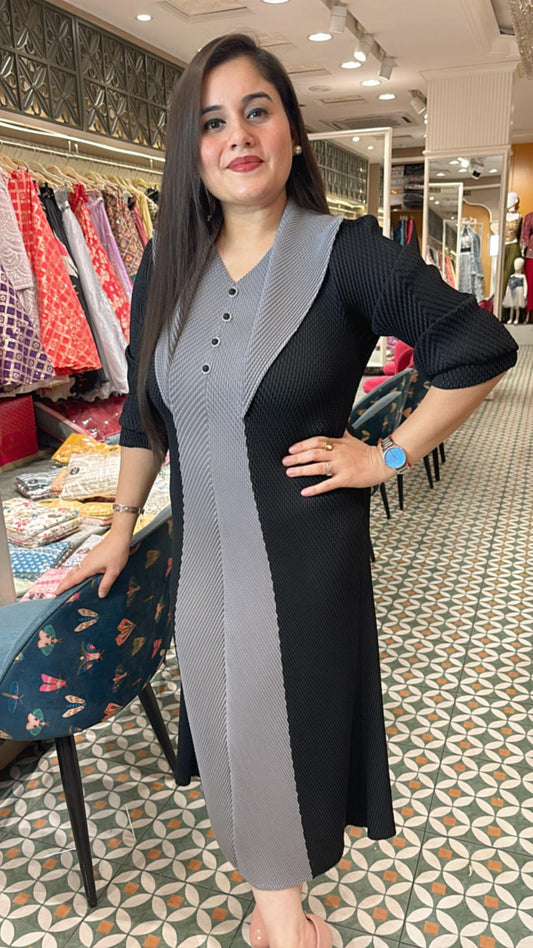 Crafted from breathable cotton Lycra, this pleated dress combines