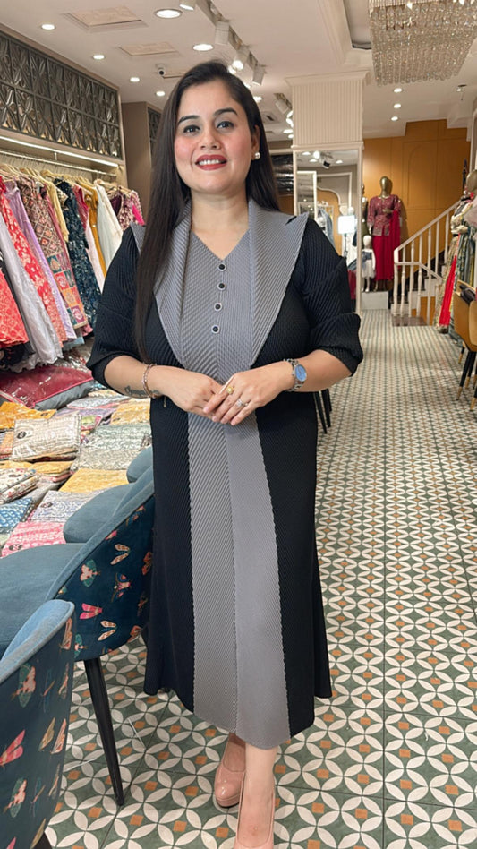 Crafted from breathable cotton Lycra, this pleated dress combines