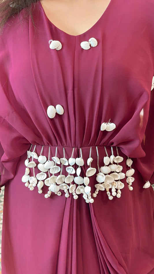 Grace every gathering in style with our elegant shell embellished dress