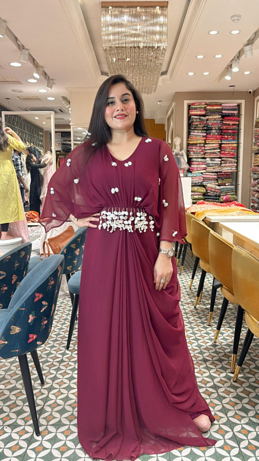 Grace every gathering in style with our elegant shell embellished dress