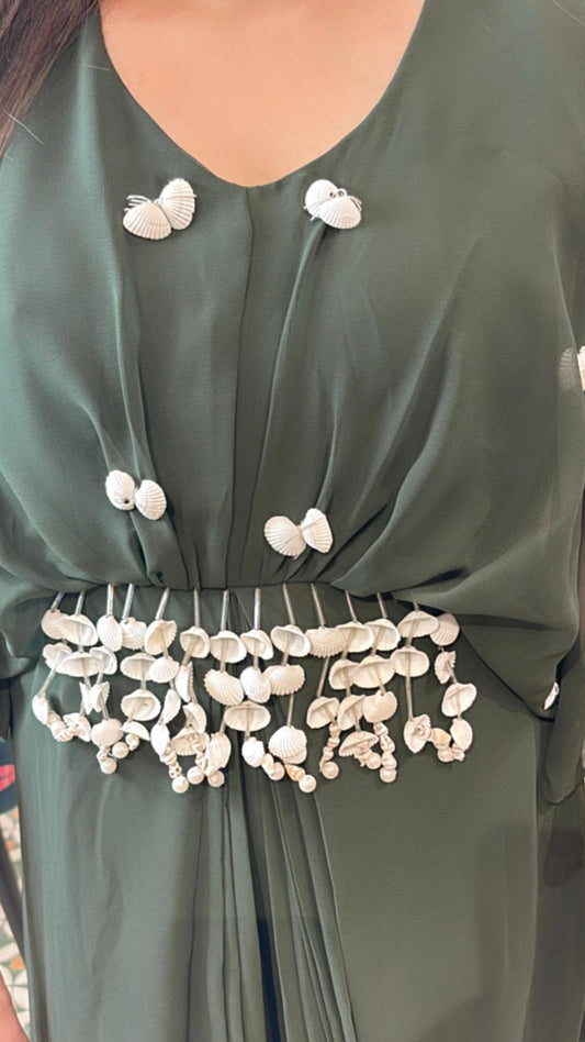 Grace every gathering in style with our elegant shell embellished dress