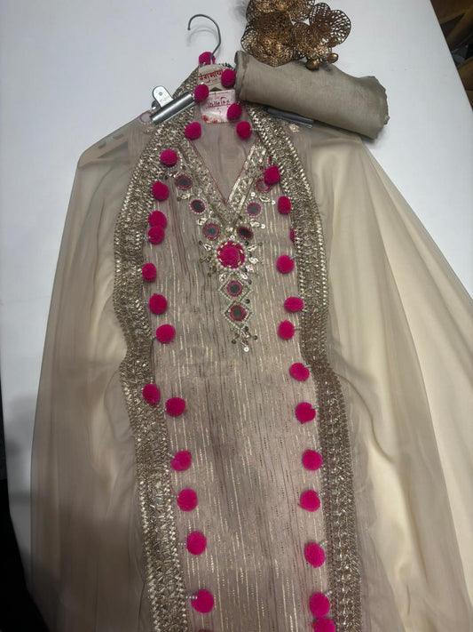 Graceful Tissue Suit Set featuring a soft tissue fabric with a matching tissue dupatta