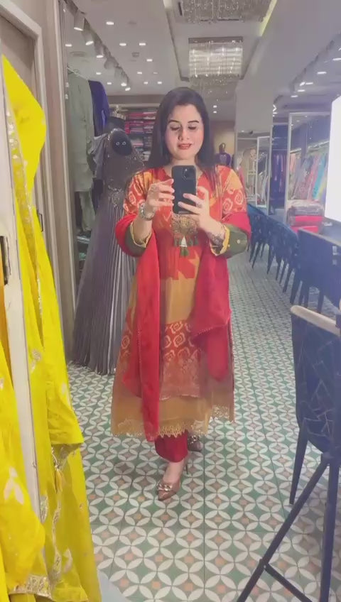 Elevate your style with this vibrant orange ready-made suit set.