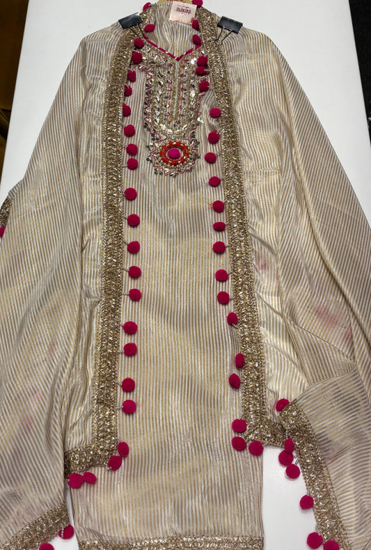 Graceful Tissue Suit Set featuring a soft tissue fabric with a matching tissue dupatta