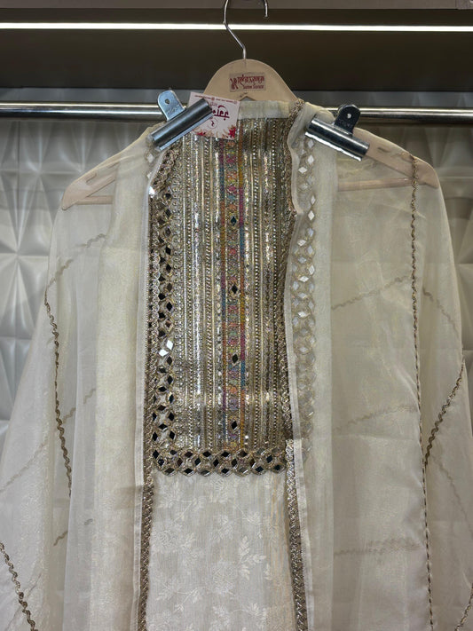 Stunning Organza Suit Set featuring all-over mirror work and embellishments