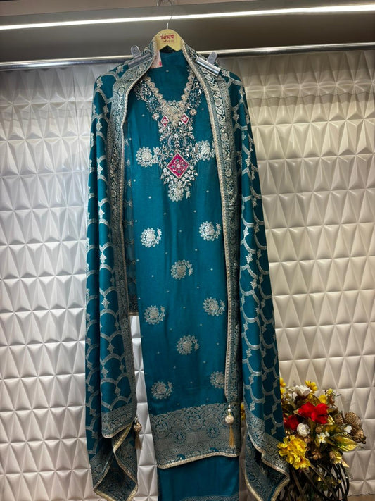 An elegant organza suit featuring a beautifully hand-embroidered neckline