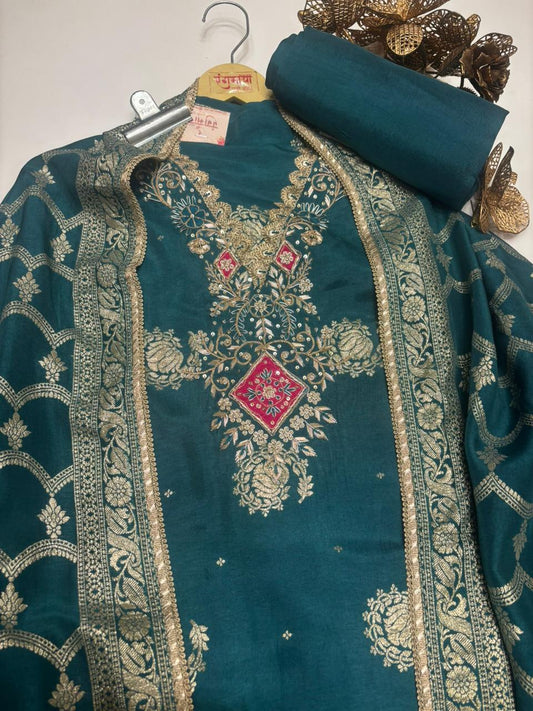 An elegant organza suit featuring a beautifully hand-embroidered neckline