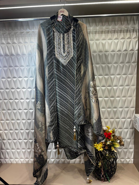 An elegant organza tissue suit featuring a beautifully hand-embroidered neckline